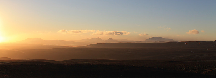 silhouette of mountains during golden hour thumbnail