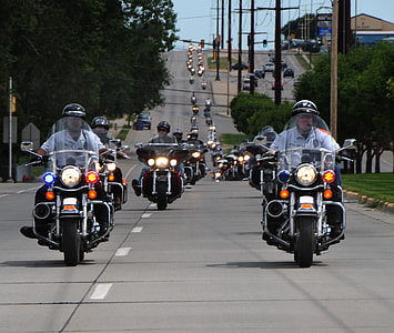 people riding touring motorcycle on highway during daytime thumbnail