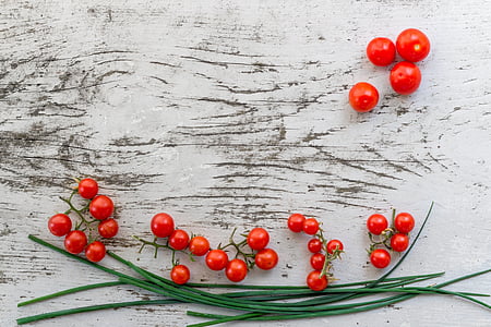 red cheery tomatoes on white surface thumbnail