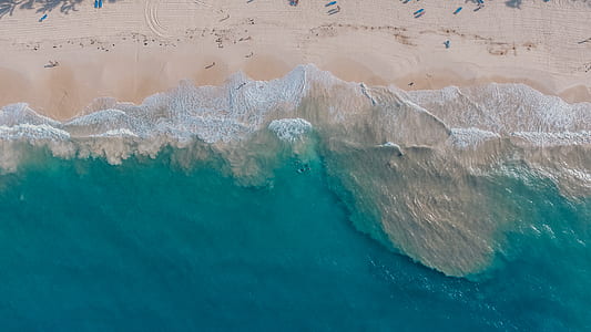 aerial photo of ocean waves near seashore during daytime thumbnail