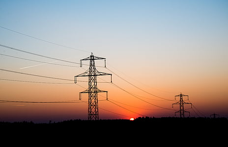 two electric towers during sunset thumbnail