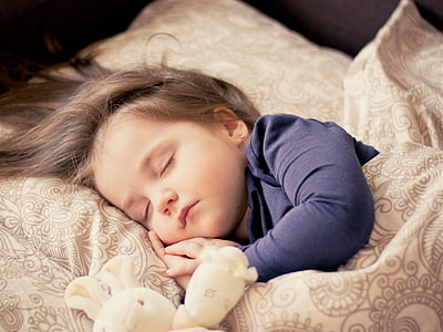 toddler wearing black long-sleeved shirt sleeping on brown bed comforter set thumbnail