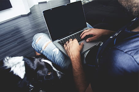 MacBook Pro on man lap thumbnail
