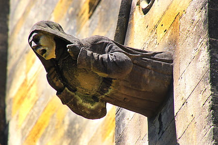 close-up photography of robe dressed person sculpture thumbnail