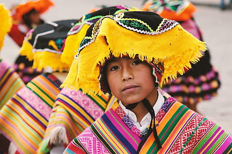 boy wearing multicolored traditional suit thumbnail