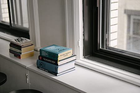 four hardbound books thumbnail