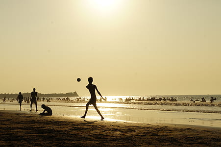 silhouette of boy playing ball thumbnail