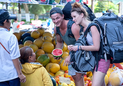 man holding watermelon during daytime thumbnail