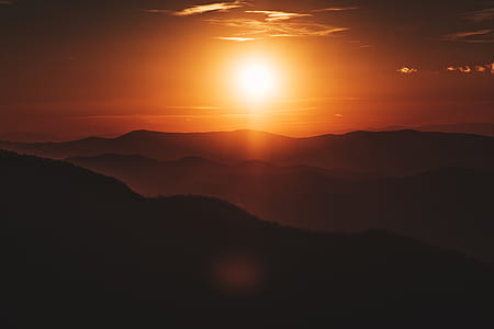 silhouette photo hills during golden hour thumbnail