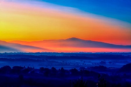 mountain covered by fog during golden hour thumbnail