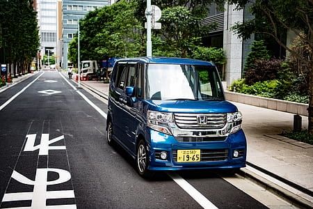 blue Honda van parked at the road beside pathway thumbnail