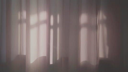 white window curtain struck by light thumbnail