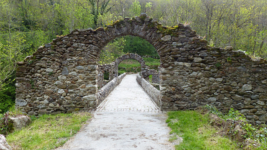 arch stone bridge near trees thumbnail