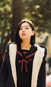 Woman Wearing Black And White Jacket thumbnail