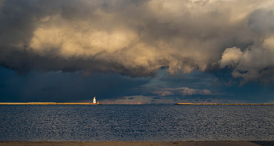 body of water across dark clouds thumbnail