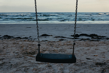 Empty swing on sea thumbnail
