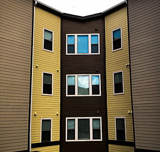 black and brown high-rise building during daytime thumbnail