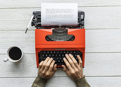 person using typewriter thumbnail