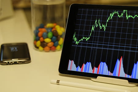 White Android Tablet Turned on Displaying a Graph thumbnail