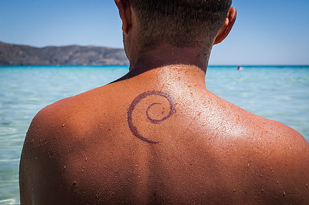 person with tattoo on his back thumbnail
