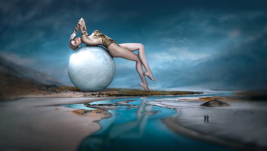 artwork of topless woman lying on white ball thumbnail