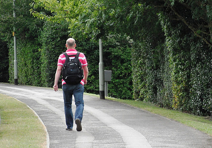 man walking on road thumbnail