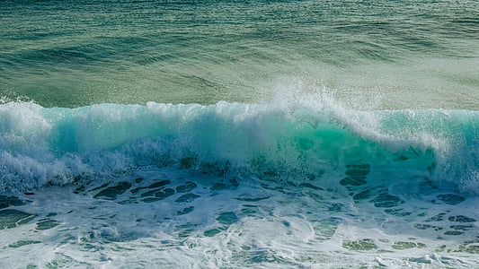 crashing waves during daytime thumbnail