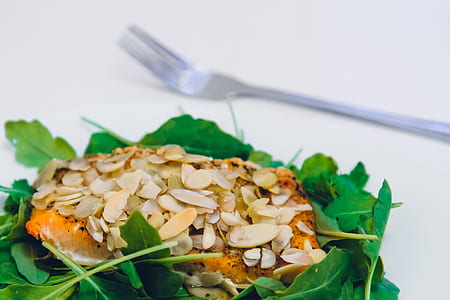 Green Leaf Covering Meat With Sesame Seeds With a Fork on the Side thumbnail