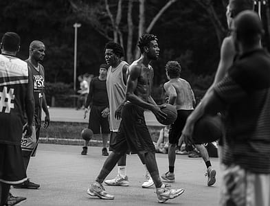 grayscale photo of men playing basketball thumbnail