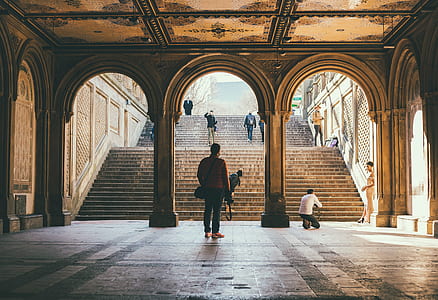 person standing near staircase thumbnail