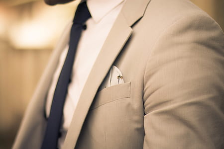 man wearing beige notched lapel suit jacket thumbnail