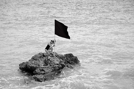 grayscale woman on rock thumbnail