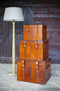 three brown wooden hope chests beside white floor lamp thumbnail