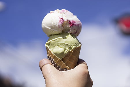 Person Holding Ice Cream With Cone thumbnail