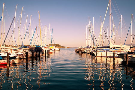 brown boats on body of water in daytime thumbnail
