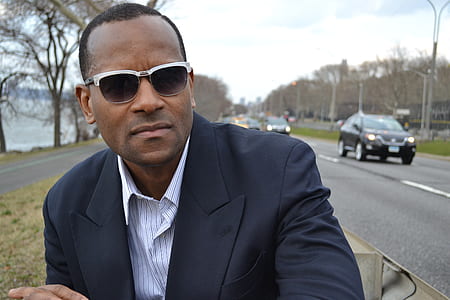 man wearing black suit jacket thumbnail
