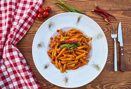 penne macaroni on white plate thumbnail