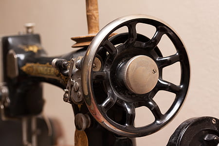 selective focus photography of hand-crank sewing machine thumbnail