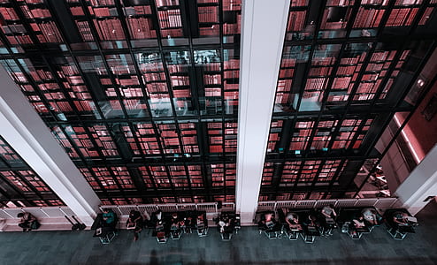 aerial photography of black and red glass buildings thumbnail