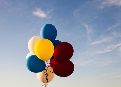yellow, blue, and maroon balloons thumbnail