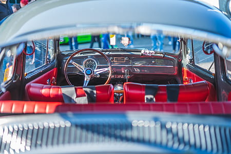 focus photography of vehicle interior with red seat thumbnail