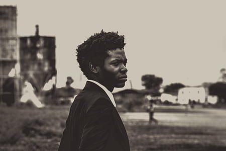 grayscale photo of man in suit thumbnail