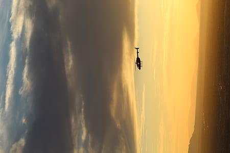 silhouette of helicopter on sky thumbnail