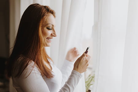 Beautiful young woman using smartphone thumbnail