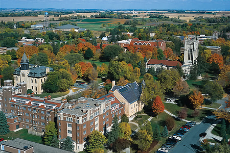 aerial photo of church and houses during daytime thumbnail