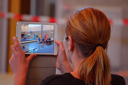woman holding tablet computer thumbnail
