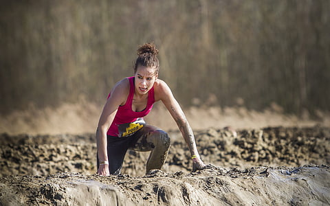 woman wearing pink tank top crawling on ground thumbnail