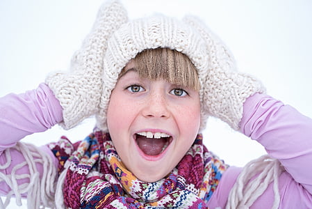 photo of girl wearing knitted mittens thumbnail