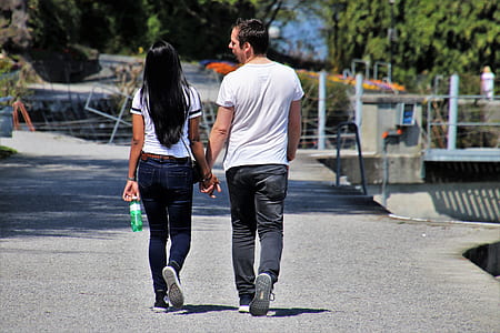 man and woman waking on concrete ground thumbnail
