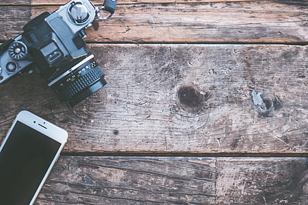 Flat-lay Photography of Iphone and Slr Camera thumbnail